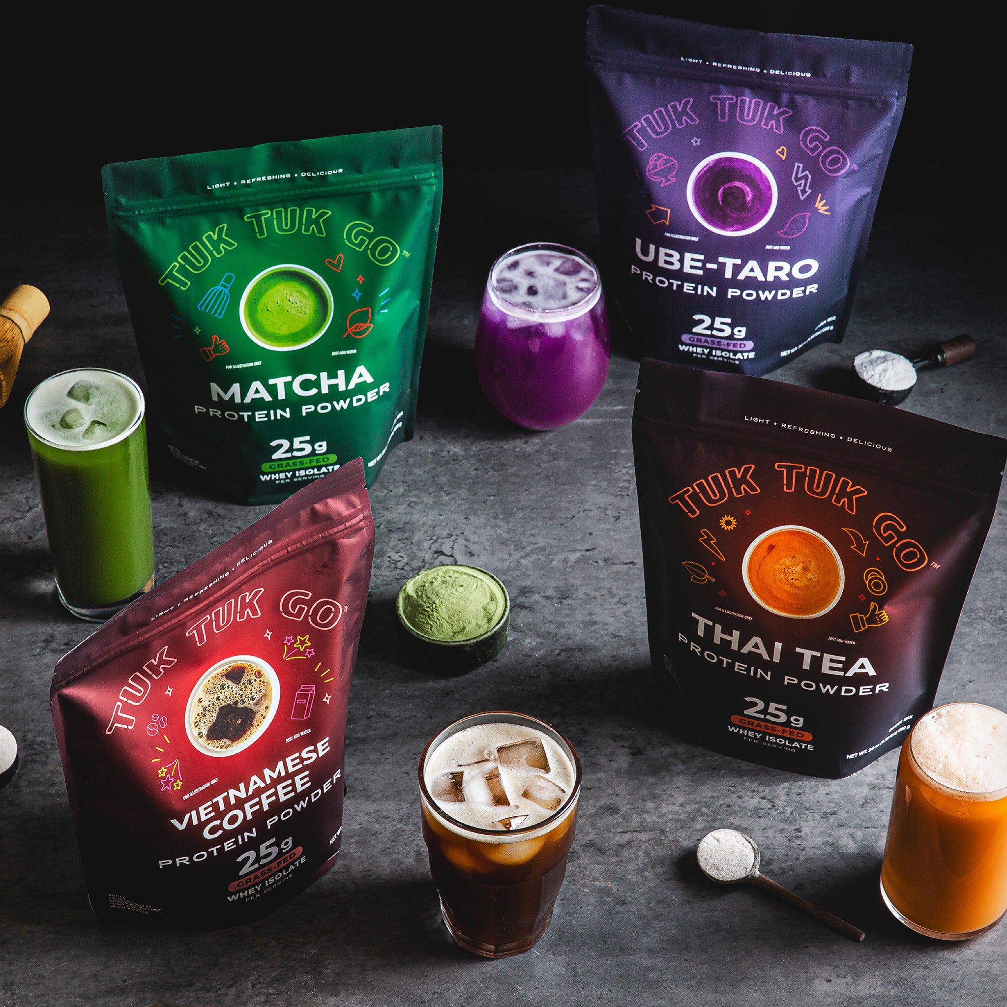 Top down shot of full line of pouches with glasses of mixed protein drink.